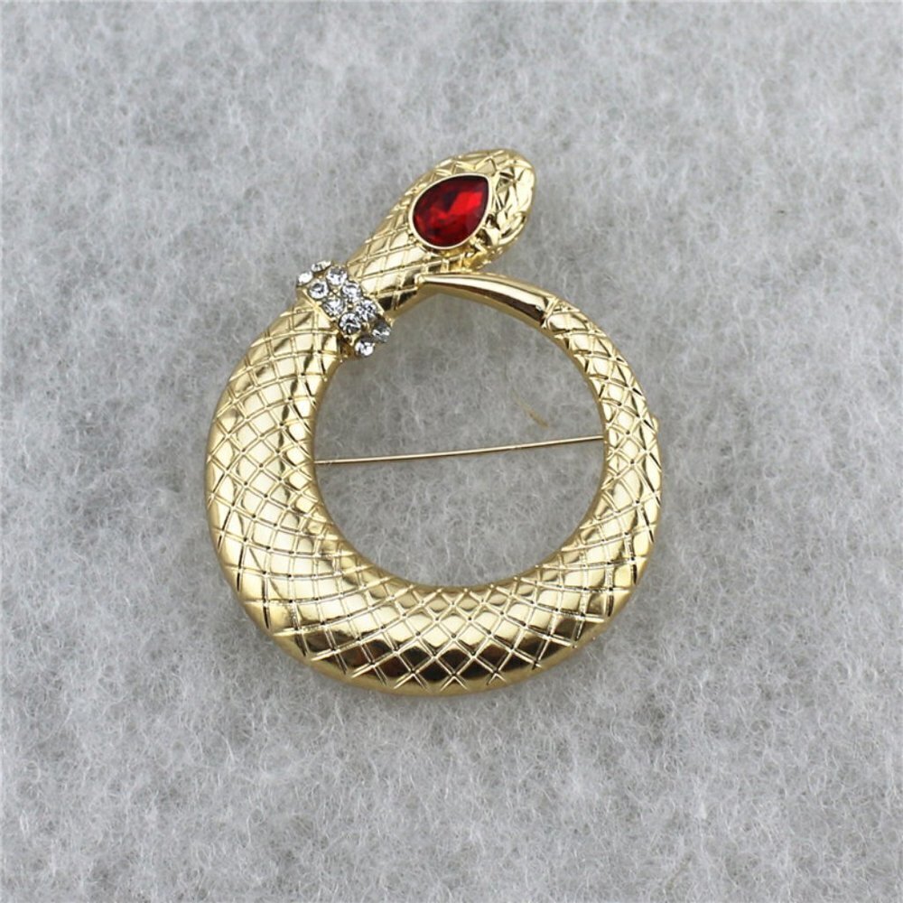 MACY'S Large gold snake brooch with crystal eye